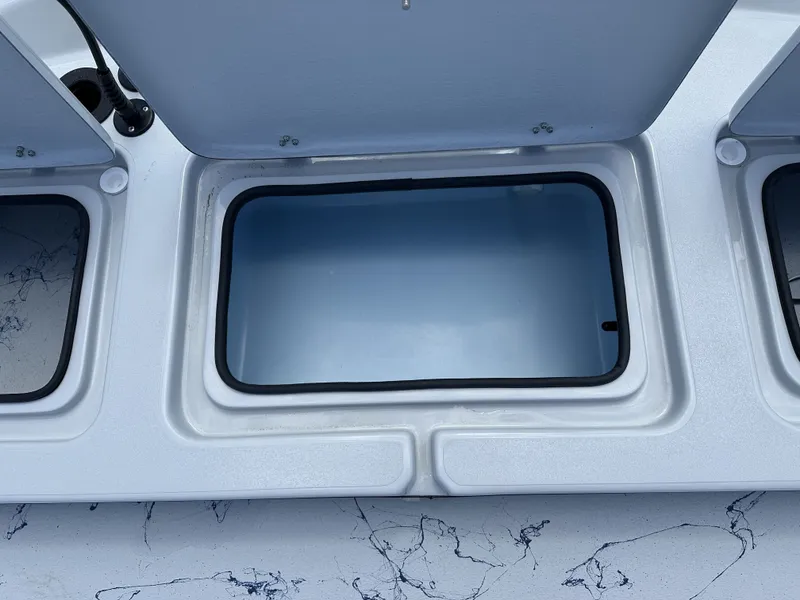Slide: The Image of Open storage compartment on a 2026 Shoalwater 23' Catamaran. - 20