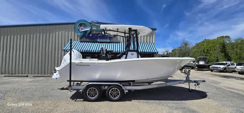 The Image of 2026 Tidewater 220 LXF boat on trailer in front of building. - 1