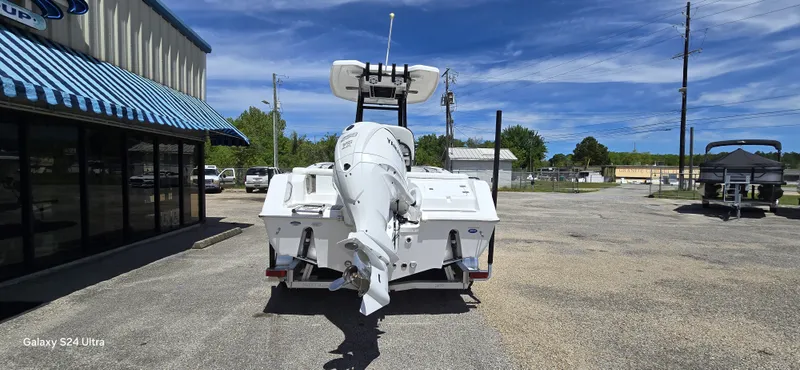 Slide: The Image of Rear view of a 2026 Tidewater 220 LXF boat in a parking lot. - 11