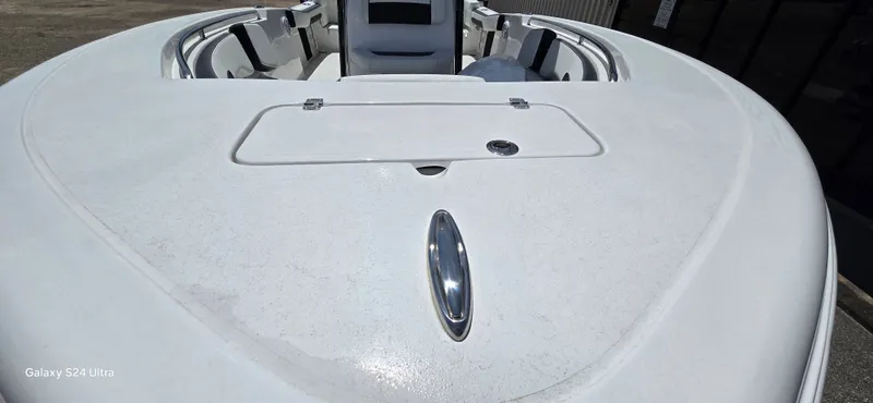 Slide: The Image of 2026 Tidewater 220 LXF boat front deck view, white design. - 14