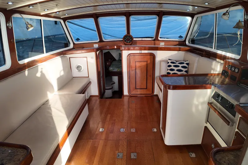 Slide: The Image of Interior of 1999 Anderson Downeast Aluminum Fast Trawler with wood accents and seating. - 12