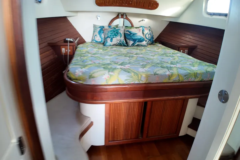 Slide: The Image of Cozy cabin interior of 1999 Anderson Downeast Aluminum Fast Trawler with floral bedding. - 14
