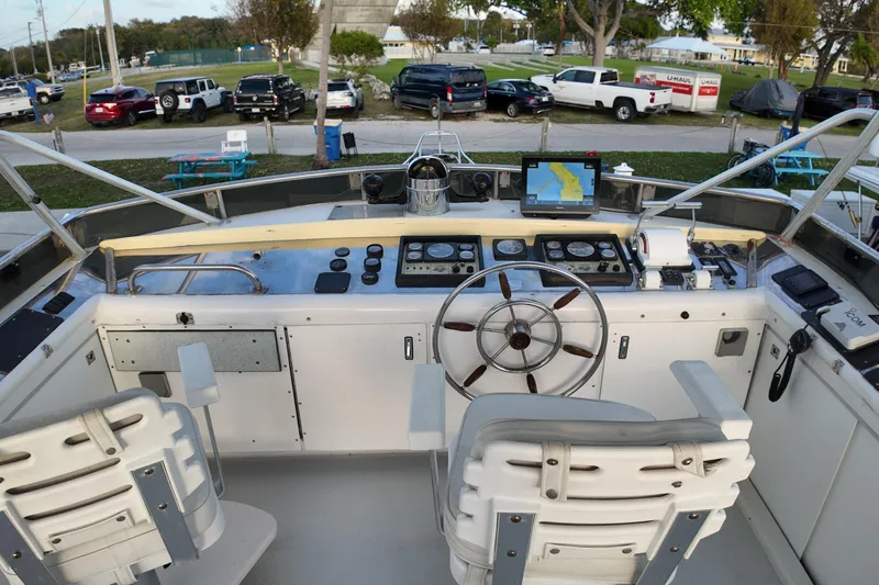 Slide: The Image of Cockpit of 1999 Anderson Downeast Aluminum Fast Trawler with navigation equipment and steering wheel. - 20