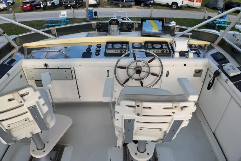 Slide: The Image of Cockpit of 1999 Anderson Downeast Aluminum Fast Trawler with navigation equipment and steering wheel. - 21