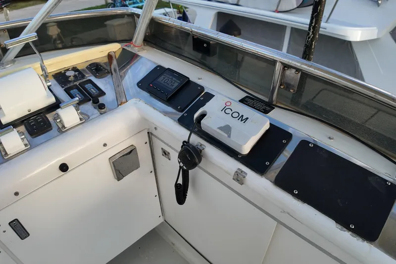 Slide: The Image of Helm of 1999 Anderson Downeast Aluminum Fast Trawler with ICOM radio and controls. - 23