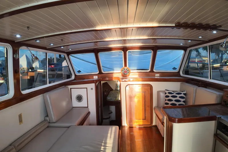 Slide: The Image of Interior of 1999 Anderson Downeast Aluminum Fast Trawler with wood accents and seating. - 29