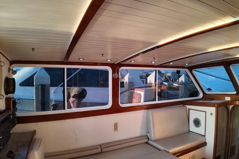 Slide: The Image of Interior of 1999 Anderson Downeast Aluminum Fast Trawler with wood accents and seating. - 30