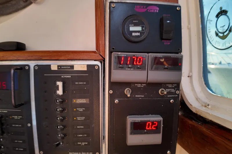 Slide: The Image of Control panel of a 1999 Anderson Downeast Aluminum Fast Trawler, displaying electrical readings. - 34