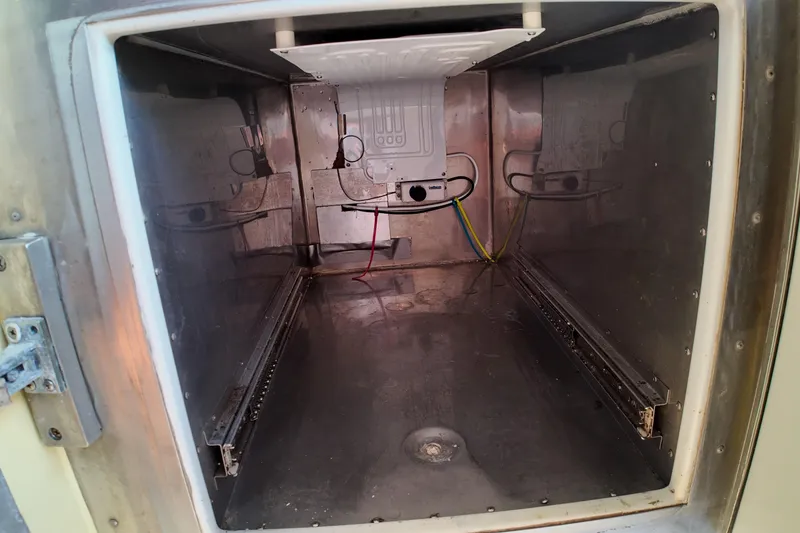 Slide: The Image of Interior of a 1999 Anderson Downeast Aluminum Fast Trawler, showcasing wiring and metal surfaces. - 37