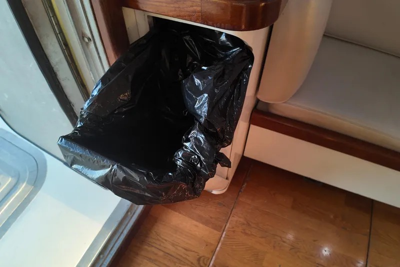 Slide: The Image of Built-in trash bin with black bag on 1999 Anderson Downeast Aluminum Fast Trawler. - 39