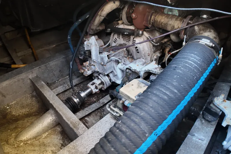 Slide: The Image of Engine compartment of a 1999 Anderson Downeast Aluminum Fast Trawler, showing mechanical components. - 42