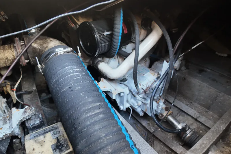 Slide: The Image of Engine compartment of a 1999 Anderson Downeast Aluminum Fast Trawler, showing hoses and components. - 43