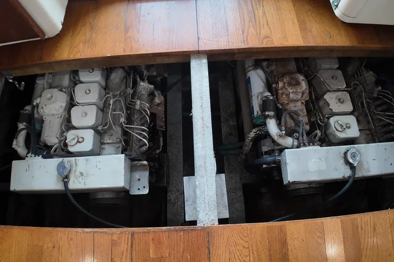 Slide: The Image of Engine room of 1999 Anderson Downeast Aluminum Fast Trawler, showcasing dual engines. - 47