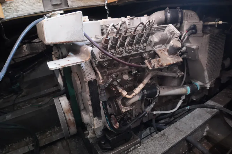 Slide: The Image of Engine of a 1999 Custom Anderson Downeast Aluminum Fast Trawler, showcasing mechanical components. - 48