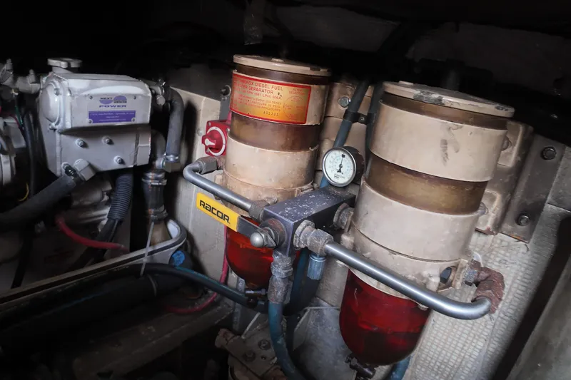 Slide: The Image of Engine room of 1999 Anderson Downeast Aluminum Fast Trawler with fuel filters and gauge. - 51