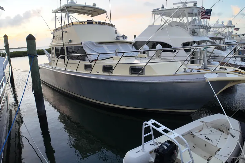 Slide: The Image of Custom 1999 Anderson Downeast Aluminum Fast Trawler docked at marina during sunset. - 54