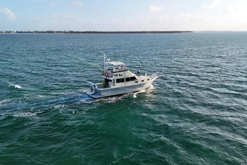 Slide: The Image of Custom 1999 Anderson Downeast Aluminum Fast Trawler cruising on open water. - 7