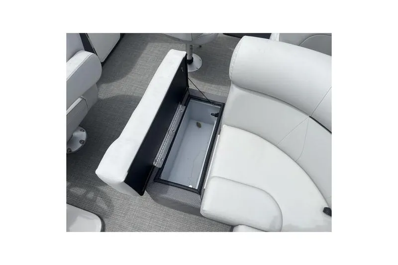 Slide: The Image of 2024 Crest Classic 220 boat seat with open storage compartment. - 14
