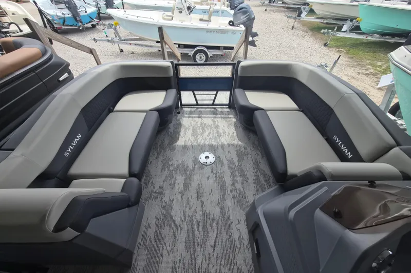 Slide: The Image of 2026 Sylvan R-22 LZ DH pontoon boat interior with spacious seating and modern design. - 2