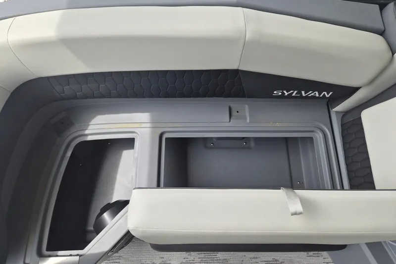 Slide: The Image of 2026 Sylvan R-22 LZ DH boat interior with storage compartment and seating. - 3