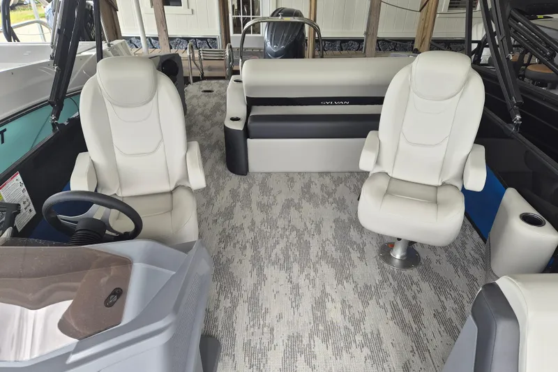 Slide: The Image of 2026 Sylvan R-22 LZ DH boat interior with white seating and modern design. - 6