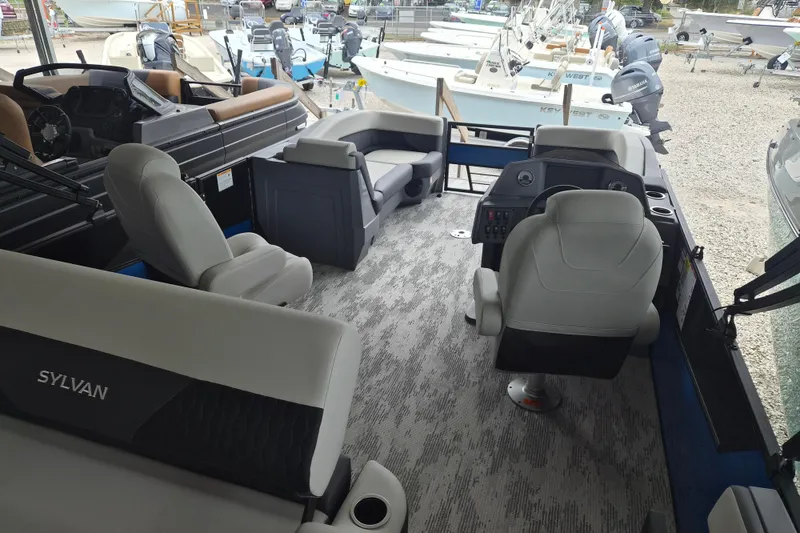 Slide: The Image of Interior of 2026 Sylvan R-22 LZ DH boat with modern seating and controls. - 8