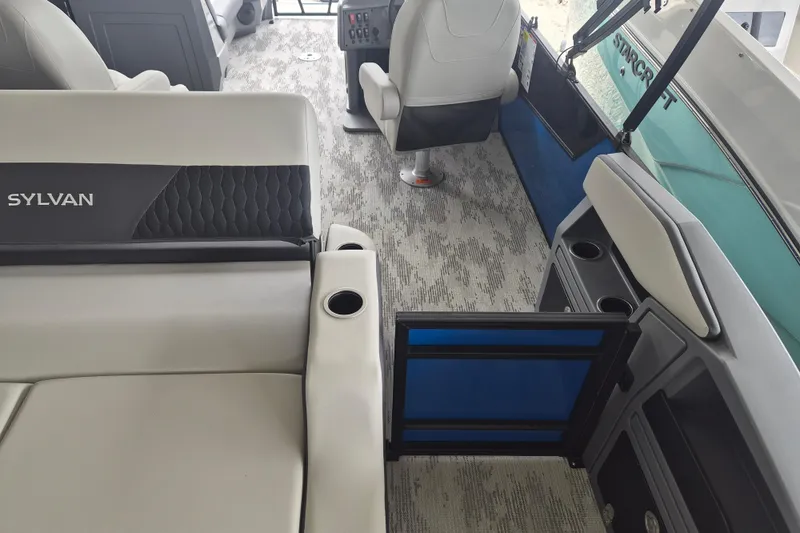 Slide: The Image of Interior of 2026 Sylvan R-22 LZ DH boat, featuring modern seating and cup holders. - 9