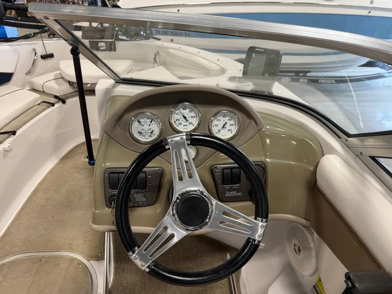 Slide: The Image of Interior of a 2010 Four Winns H190 F/S boat with dashboard. - 12