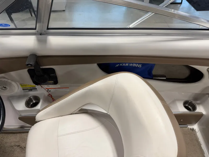 Slide: The Image of Interior of a 2010 Four Winns H190 F/S boat with white seating. - 17