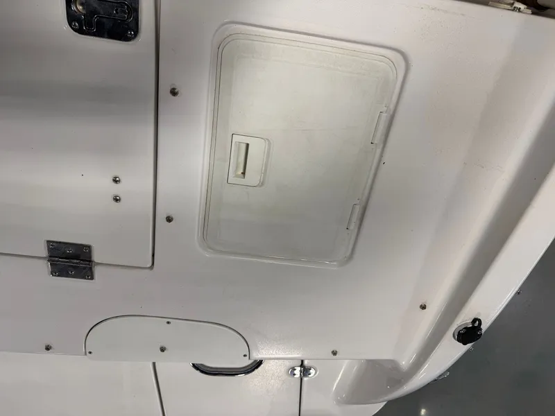 Slide: The Image of Interior of a 2010 Four Winns H190 F/S boat with storage hatch. - 23