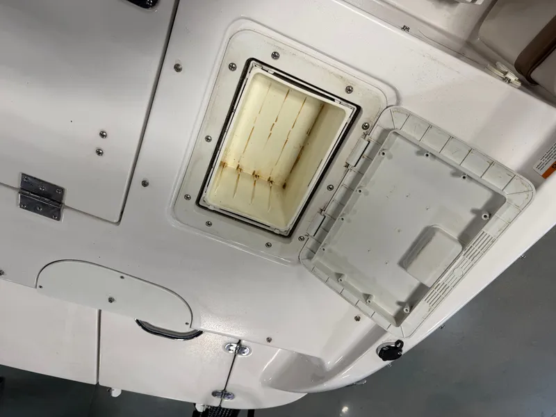 Slide: The Image of Open storage compartment on a 2010 Four Winns H190 F/S boat. - 24