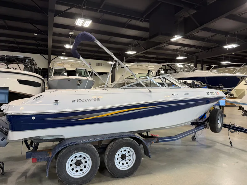 Slide: The Image of 2010 Four Winns H190 F/S boat in showroom on trailer. - 27