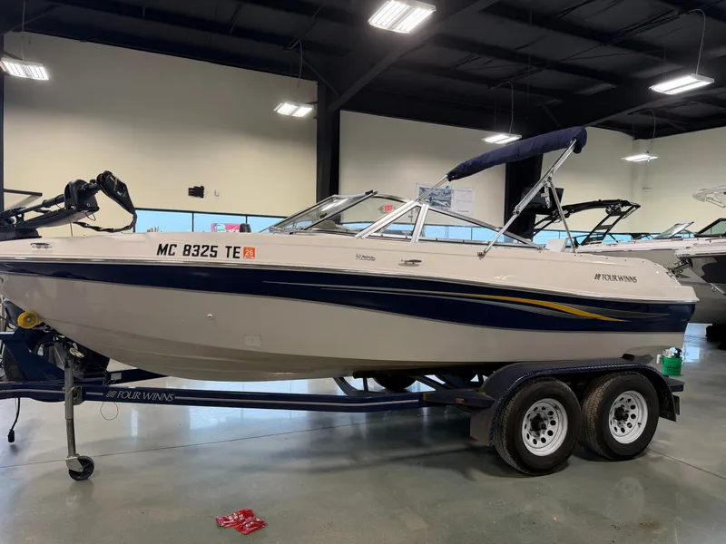 Slide: The Image of 2010 Four Winns H190 F/S boat on trailer in showroom. - 4