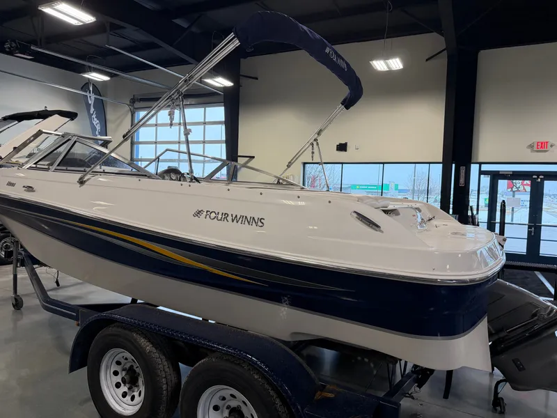 Slide: The Image of 2010 Four Winns H190 F/S boat in showroom. - 5