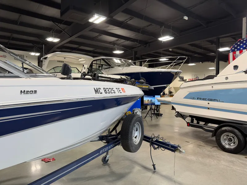 Slide: The Image of 2010 Four Winns H190 F/S boat in showroom. - 6