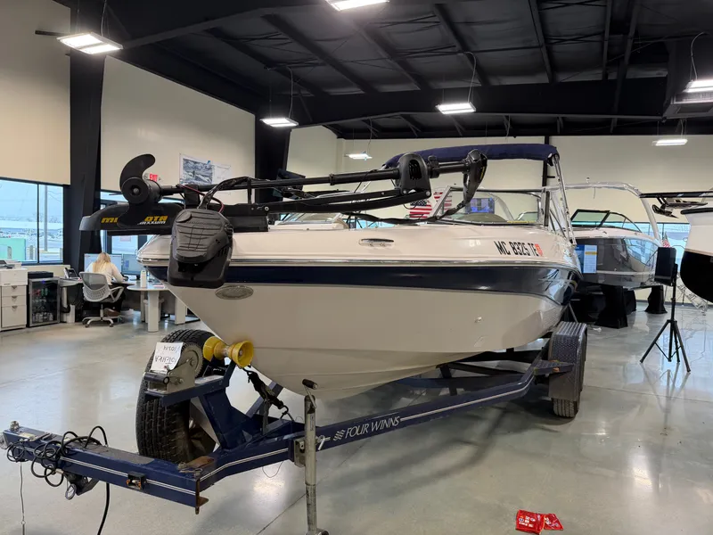 Slide: The Image of 2010 Four Winns H190 F/S boat in a workshop. - 8