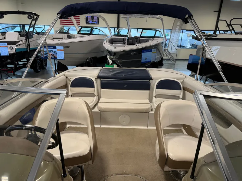 Slide: The Image of Interior view of a 2010 Four Winns H190 F/S boat in showroom. - 9