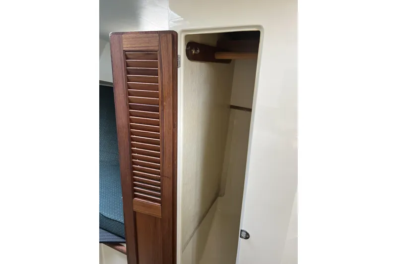 Slide: The Image of 1998 General Marine Custom Downeast boat interior with wooden louvered cabinet door. - 22