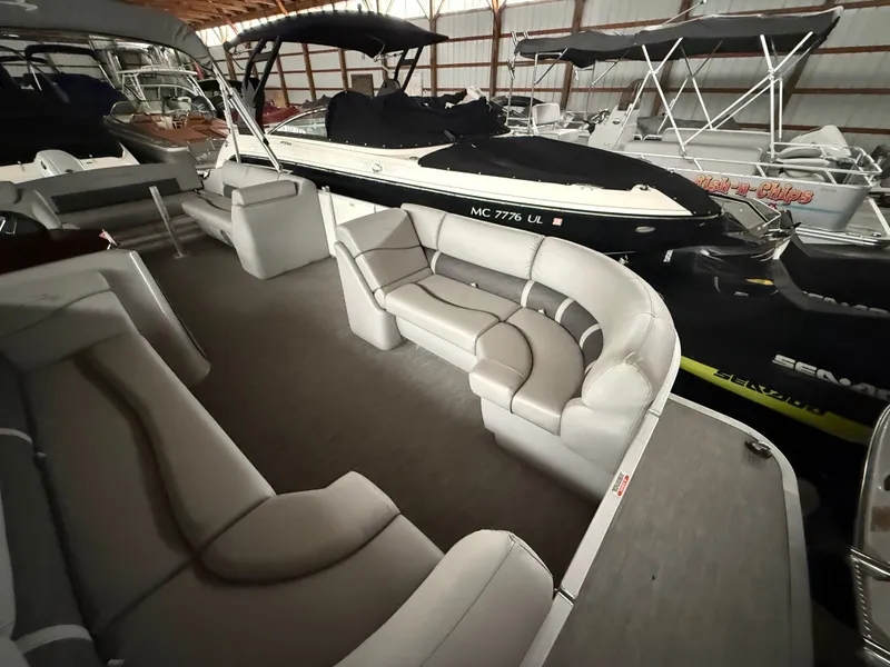 Slide: The Image of Interior of a 2021 Bennington SSBXSD pontoon boat in a storage facility. - 12