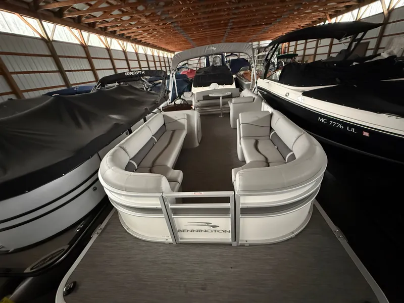 Slide: The Image of 2021 Bennington SSBXSD pontoon boat in storage facility. - 18