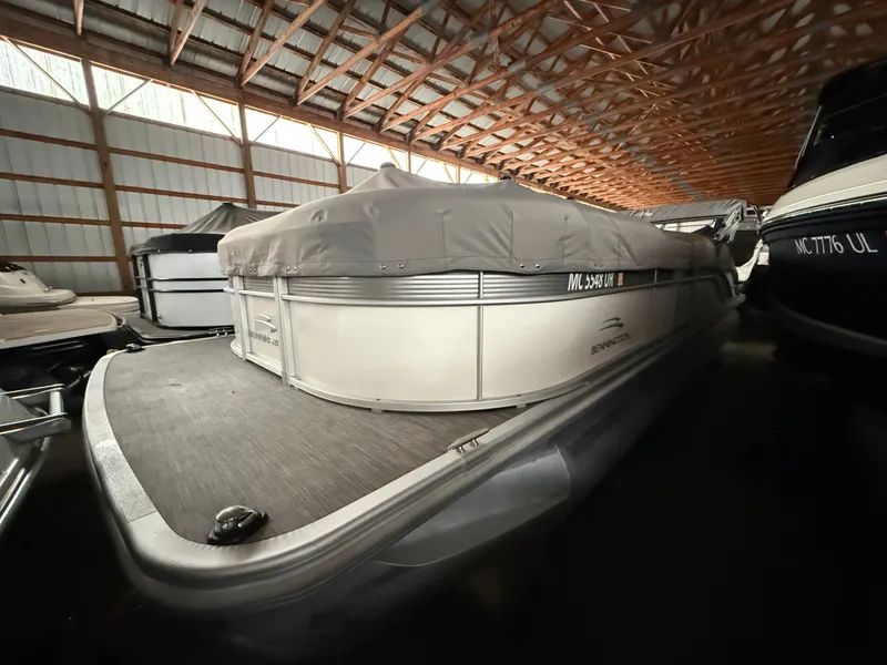 Slide: The Image of 2021 Bennington SSBXSD pontoon boat in storage facility. - 4