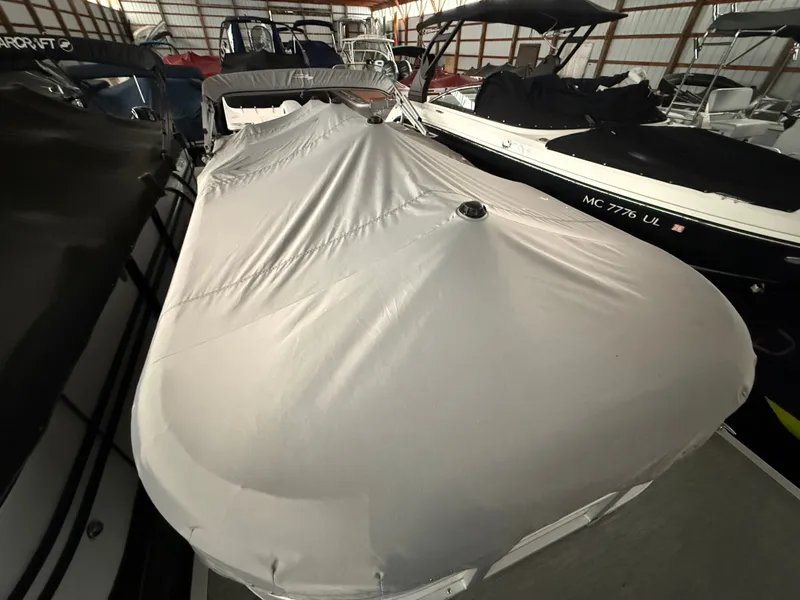 Slide: The Image of Covered 2021 Bennington SSBXSD boat in storage facility. - 5
