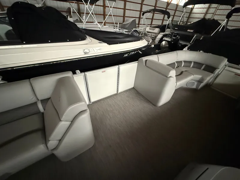 Slide: The Image of Interior of a 2021 Bennington SSBXSD pontoon boat with gray seating. - 9