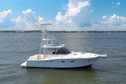 The Image of 2008 Tiara Yachts 3200 Open cruising on a calm lake under a clear blue sky. - 0