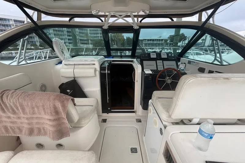 Slide: The Image of 2008 Tiara Yachts 3200 Open interior with helm, seating, and navigation equipment. - 10