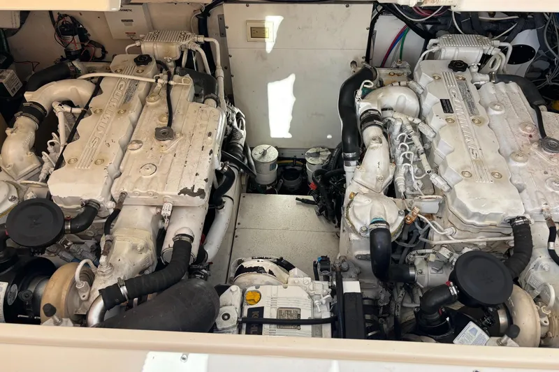 Slide: The Image of Engine compartment of a 2008 Tiara Yachts 3200 Open, featuring dual Cummins engines. - 12