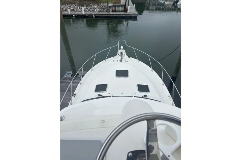 Slide: The Image of 2008 Tiara Yachts 3200 Open boat docked at marina, viewed from helm. - 6