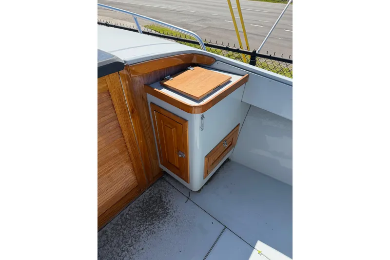 Slide: The Image of 2020 Strike 26' Center Console Cuddy boat interior with wooden cabinetry detail. - 11