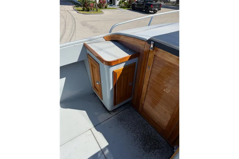 Slide: The Image of 2020 Strike 26' Center Console Cuddy with wooden cabinetry detail. - 12