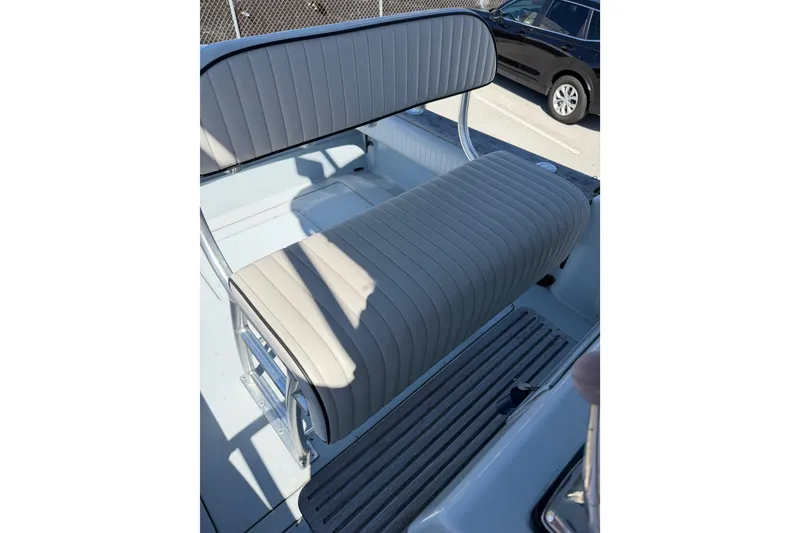 Slide: The Image of 2020 Strike 26' Center Console Cuddy boat seat with striped upholstery. - 14